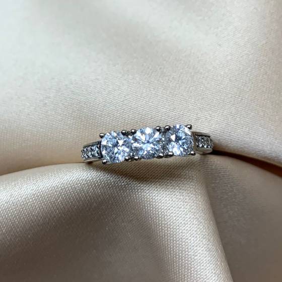 0.65ct VS1/F-G Natural Round Cut Diamond Trilogy Ring in Platinum